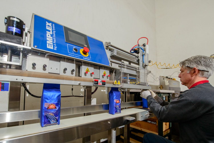 Charles Sarin Packaging Coffee at Coffee Express Roasting Company
