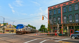An Amtrak train passes through Depot Town