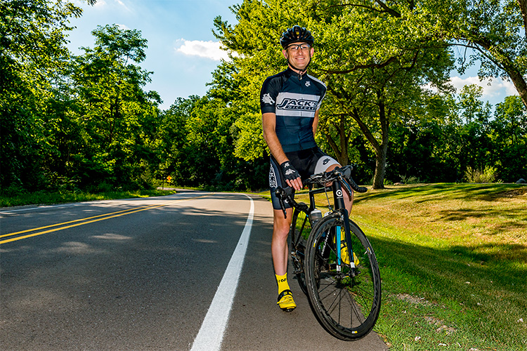 Al McWillians biking on Huron River Drive