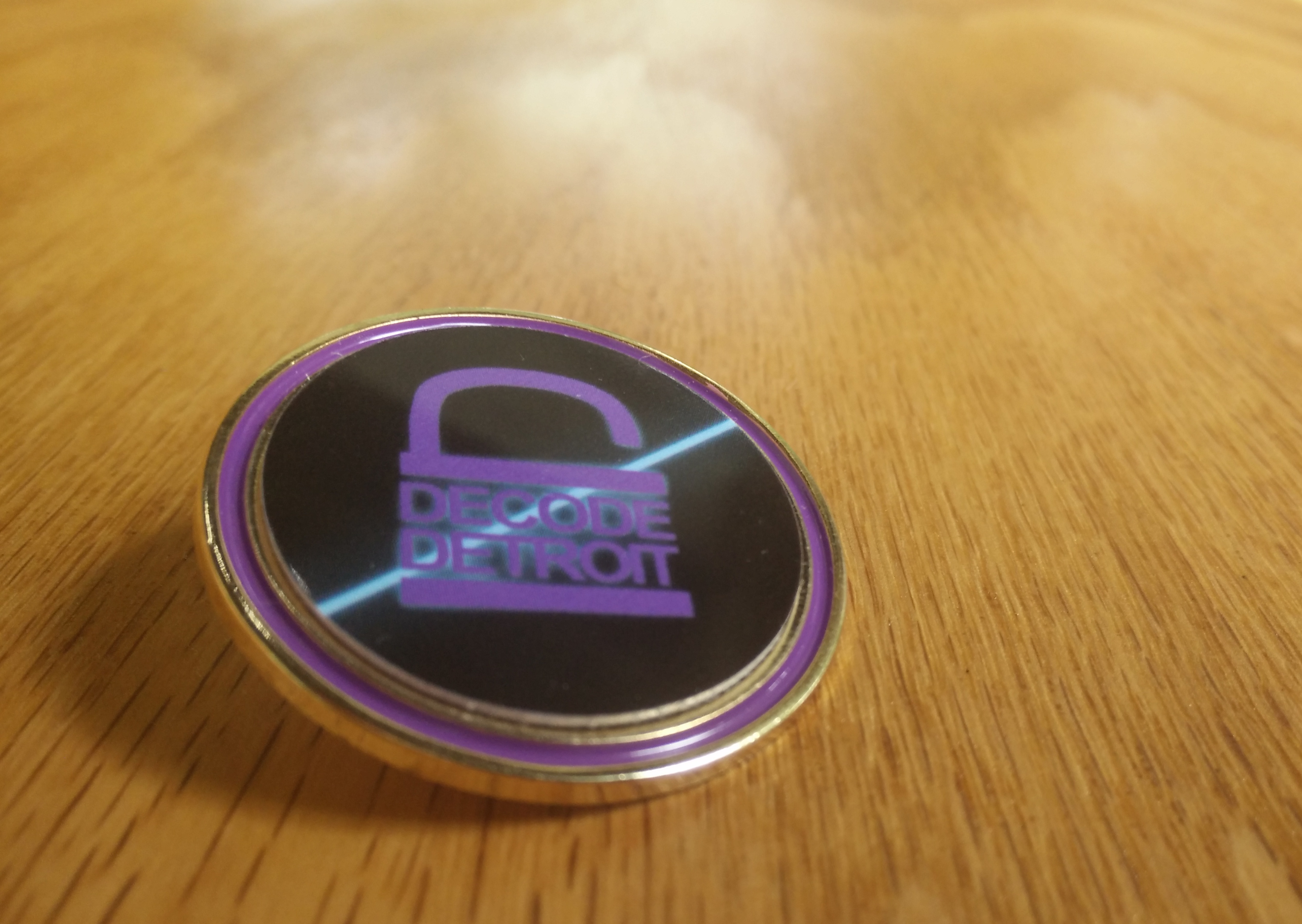 A Decode Detroit badge.