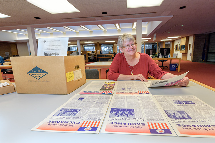 Deb Anderson looking through the Youth For Understanding archives at the Bentley Historical Library at U of M
