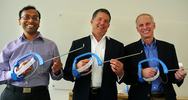 FlexDex cofounder Shorya Awtar, FlexDex chief marketing officer Greg Bowles, and surgeon and FlexDex cofounder James Geiger hold FlexDex surgical devices.