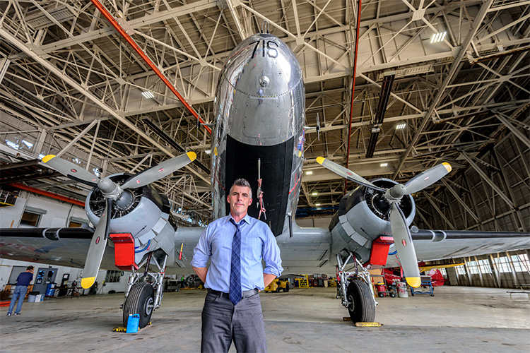 Kevin Walsh with the C-47 at the Yankee Air Museum