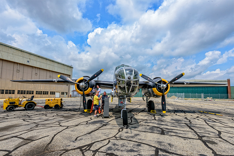 Engine maintenance being performed on the B-25 at the Yankee Air Museum