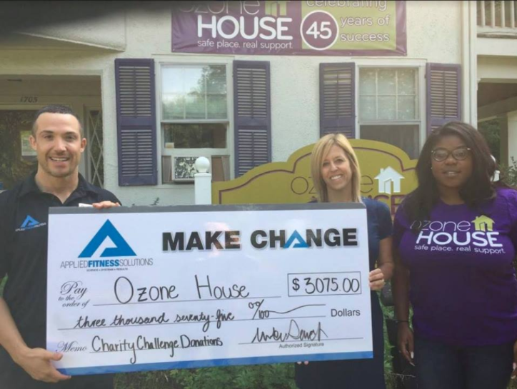 AFS founder Mike Stack presents Ozone House staff with the proceeds from AFS' charity challenge.