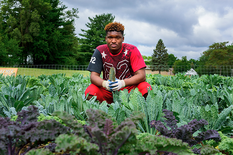 Jamari Jefferson at We The People Growers Association gardens