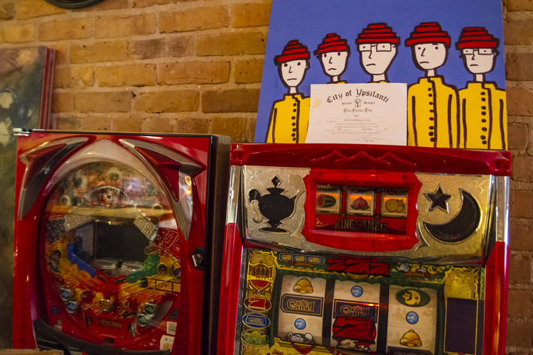 Video games and a Jason Gibner painting of Devo at Ziggy's.