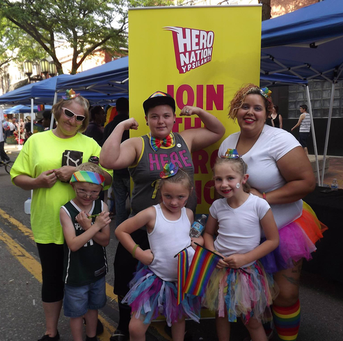 People visit the Hero Nation booth at Ypsi Pride.