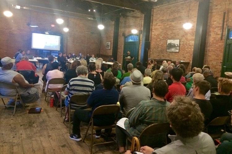 Defend Affordable Ypsi organizer Nathanael Romero speaks at Tuesday night's meeting.