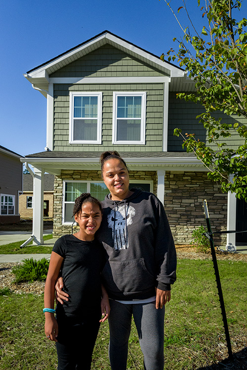 Amelia Reese and her daughter Khloe Porter outside her home in New Parkridge