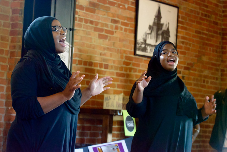 A performance of Voices From Ozone at the Ypsilanti Freighthouse