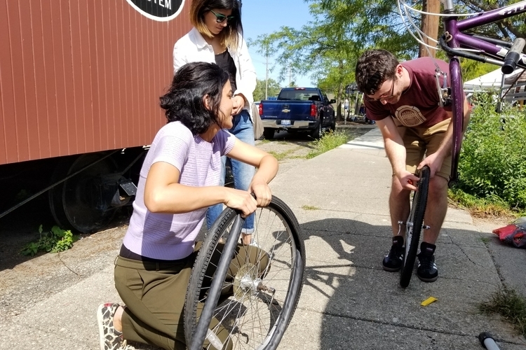 Volunteers and cyclists work together at the Ypsi Bike Co-Op.