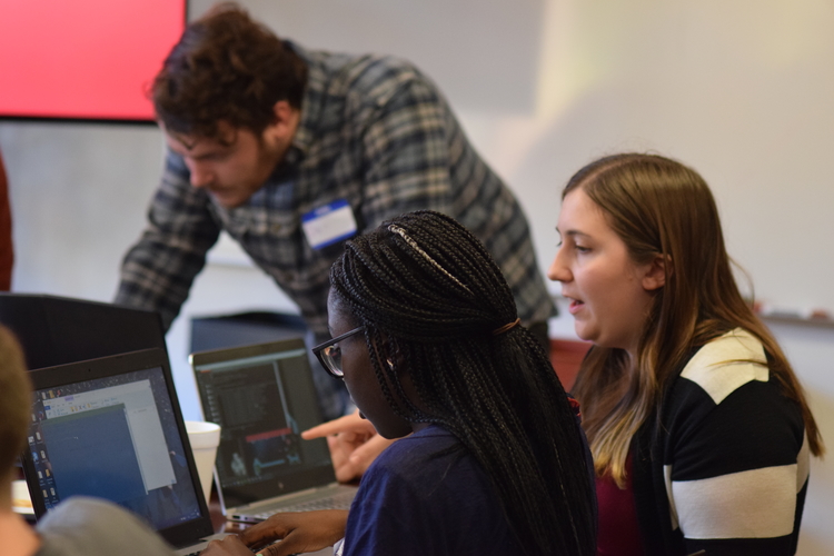 Atomic Games winner Daniel Michelin, Octavia Smith, and Sivhaun Sera at work during the Atomic Games.