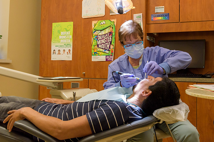 Hope Dental Clinic Dentist Denise Toomasian treats client Oscar Diaz