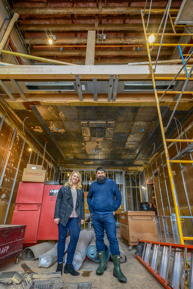 Alison Todak and Joe Malcoun stand in the future lobby at Cahoots