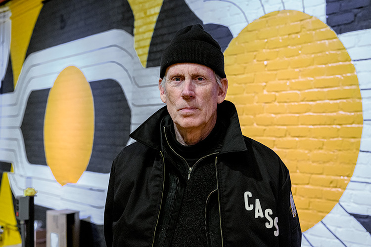 Robert Sestok in front of his mural at Third Man Pressing in the Cass Corridor