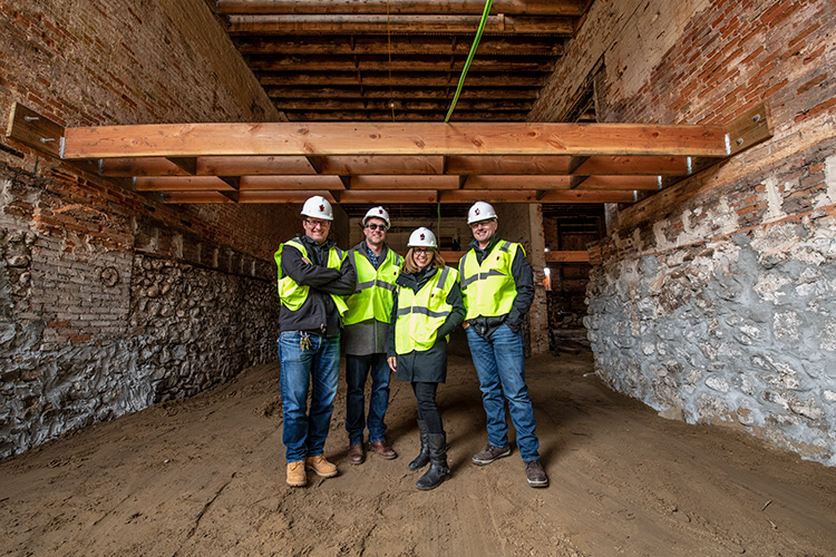 Jon Carlson, Greg Lobdell, Liz Marek and Rob Eisman at the Thompson Block redevelopment on April 2, 2018