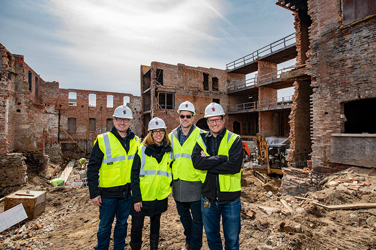 Rob Eisman, Liz Marek, Greg Lobdell and Jon Carlson at the Thompson Block redevelopment on April 2, 2018