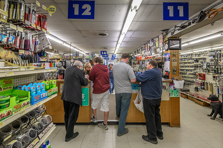 Customers at the counter of Stadium Hardware