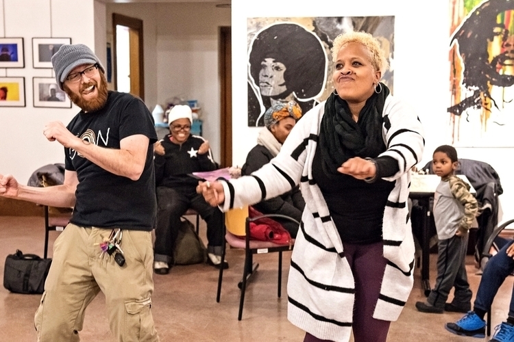 Participants dance at a Riverside Arts Center event.