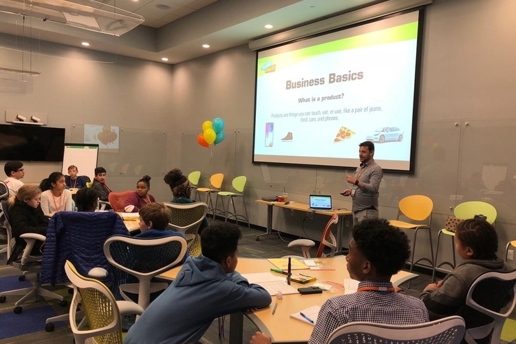 A presenter speaks at a Running Start workshop.