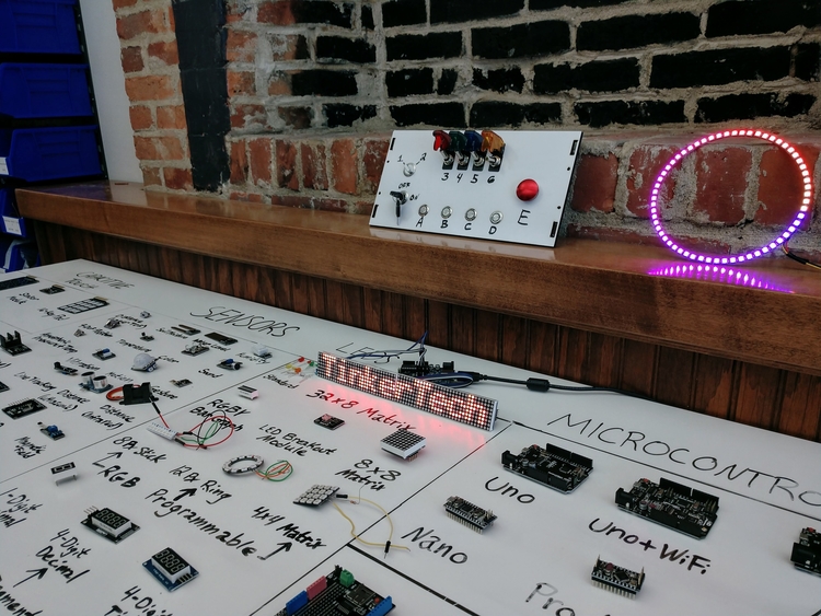 An electronics demo table at TinkerTech.