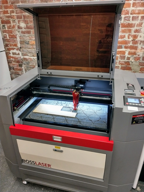 A laser cutter at TinkerTech.