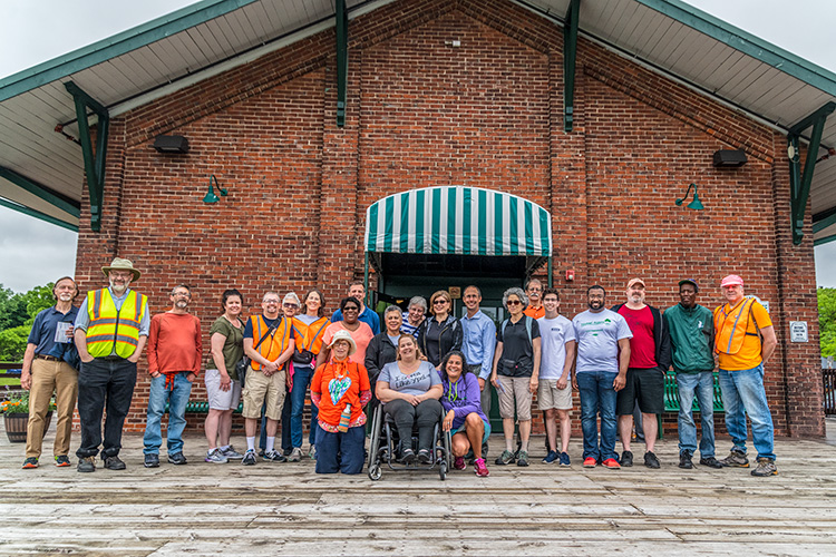 Bridging 23 participants reach the end of the walk at the Ypsilanti Freighthouse