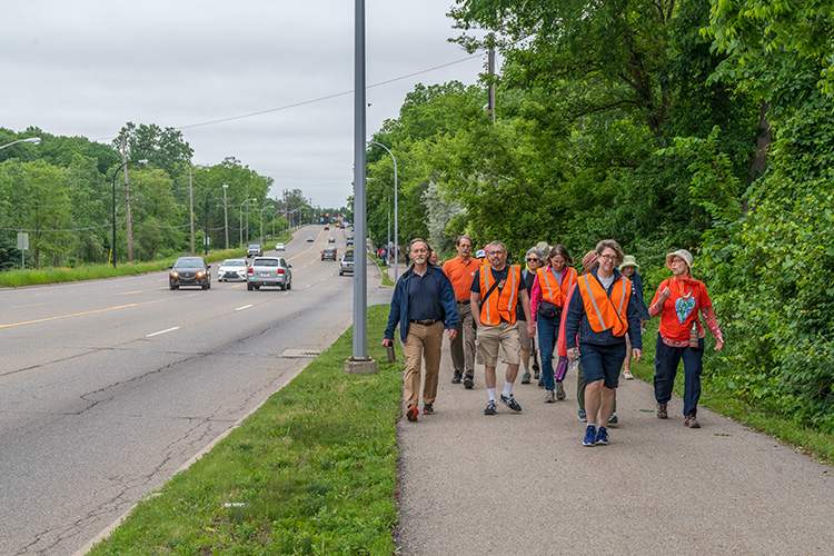 The Bridging 23 Unity March walking in Ann Arbor