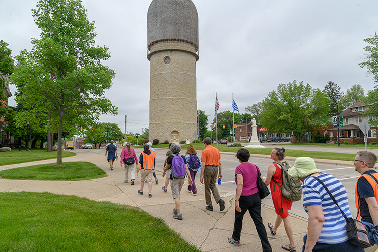 The Bridging 23 Unity March walking past the Water Tower in Ypsilanti