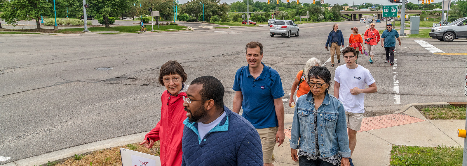 Participants in the Bridging 23 Unity March pass US-23 on their way to Ypsilanti