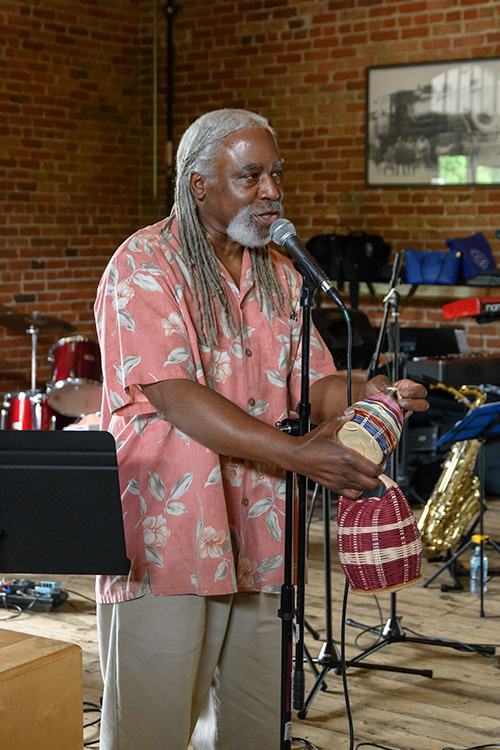 La'Ron Williams performs for Bridging 23 participants at the Ypsilanti Freighthouse