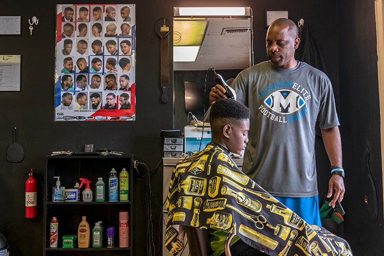 Village Project success coach Ryan Griffin at Griff's Unlimited Cutz