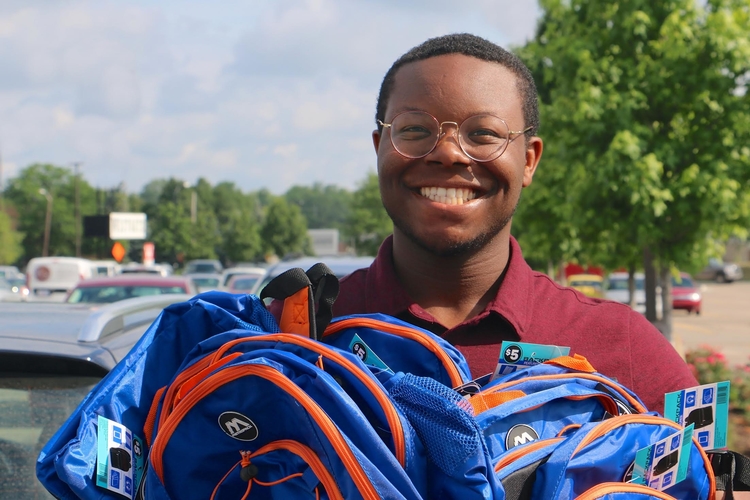 Packard Health intern Zion Jackson gets ready for the Healthy Kids Fair.