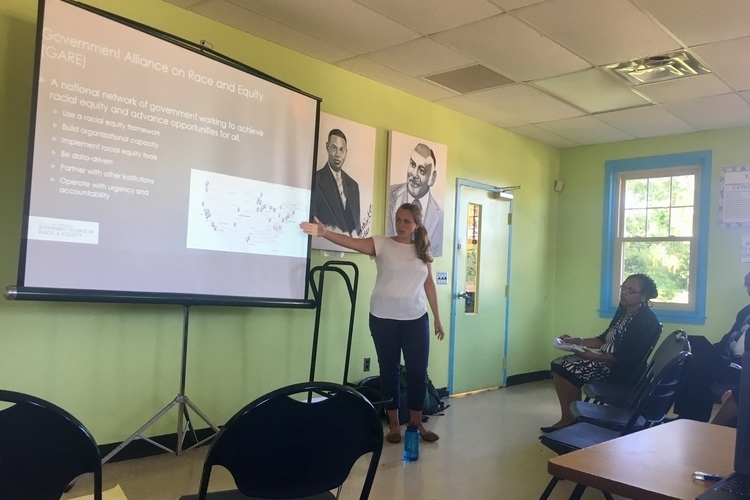 Racial equity analyst Anna Lemler presents during a feedback session at Parkridge Community Center.