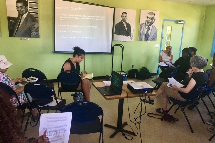 Brabec, Lemler, and attendees work at a community feedback session at Parkridge Community Center.