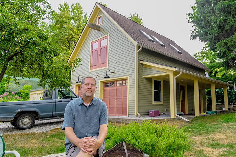 Richard Norton in front of his new garage on the Old West Side of Ann Arbor