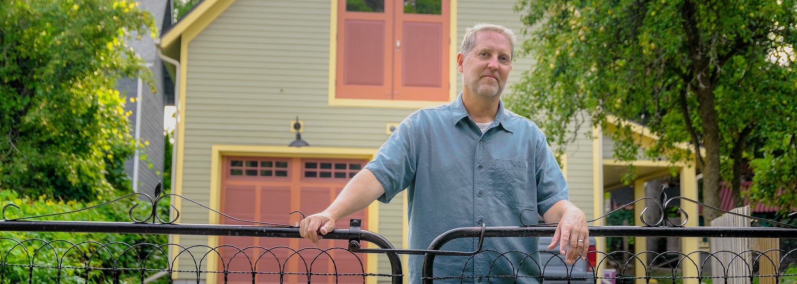 Richard Norton in front of his new garage on the Old West Side of Ann Arbor