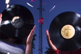 WCBN staffers hold up records in front of their new transmitter.