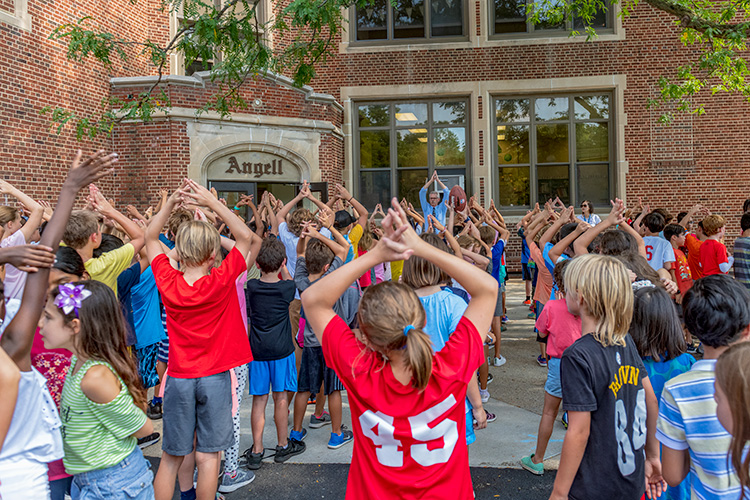 Principal Gary Court with students at Angell Elementary