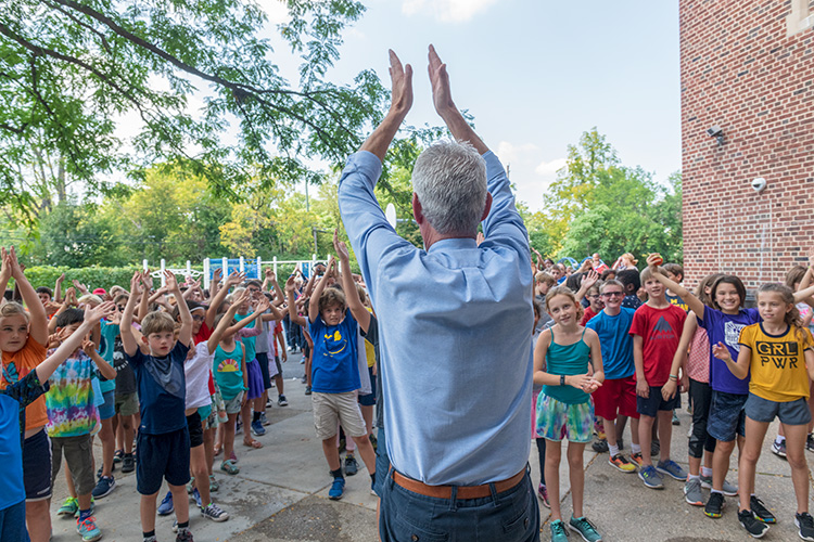 Principal Gary Court with students at Angell Elementary