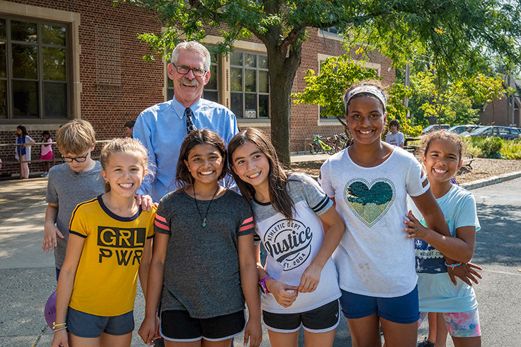 Principal Gary Court with students at Angell Elementary