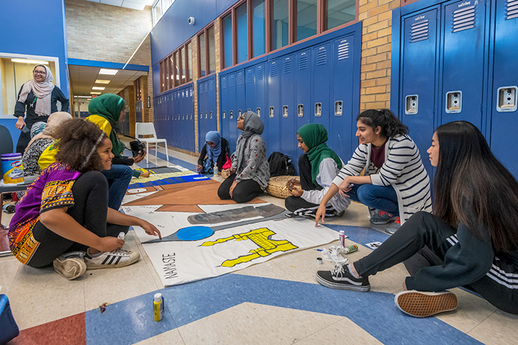 WiHi's Muslim Student Association painting a mural for WiHi's 8th International Dinner