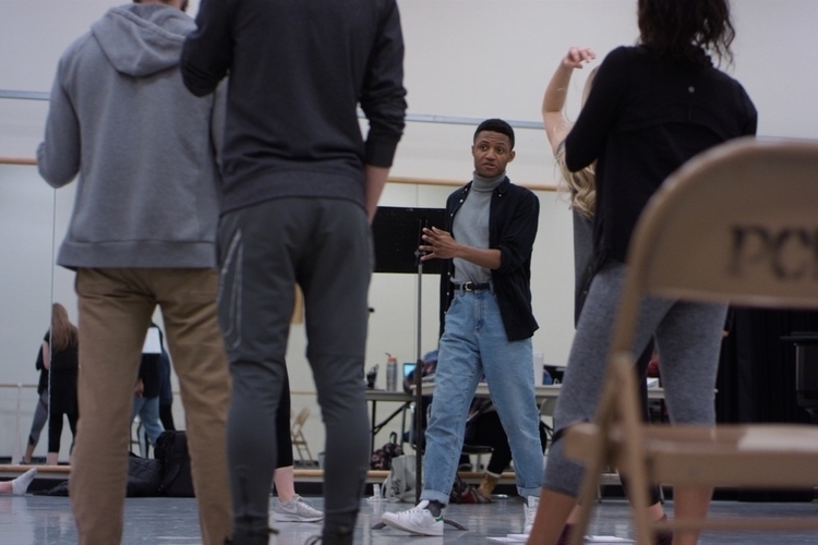 Runyonland choreographer Chris Campbell works with the cast in SHEL rehearsals.