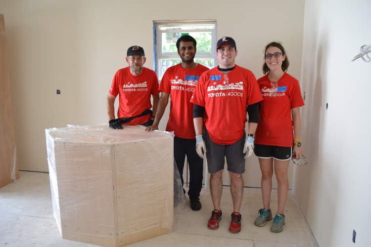 Toyota volunteers work on a Habitat for Humanity house in Ypsi Township.