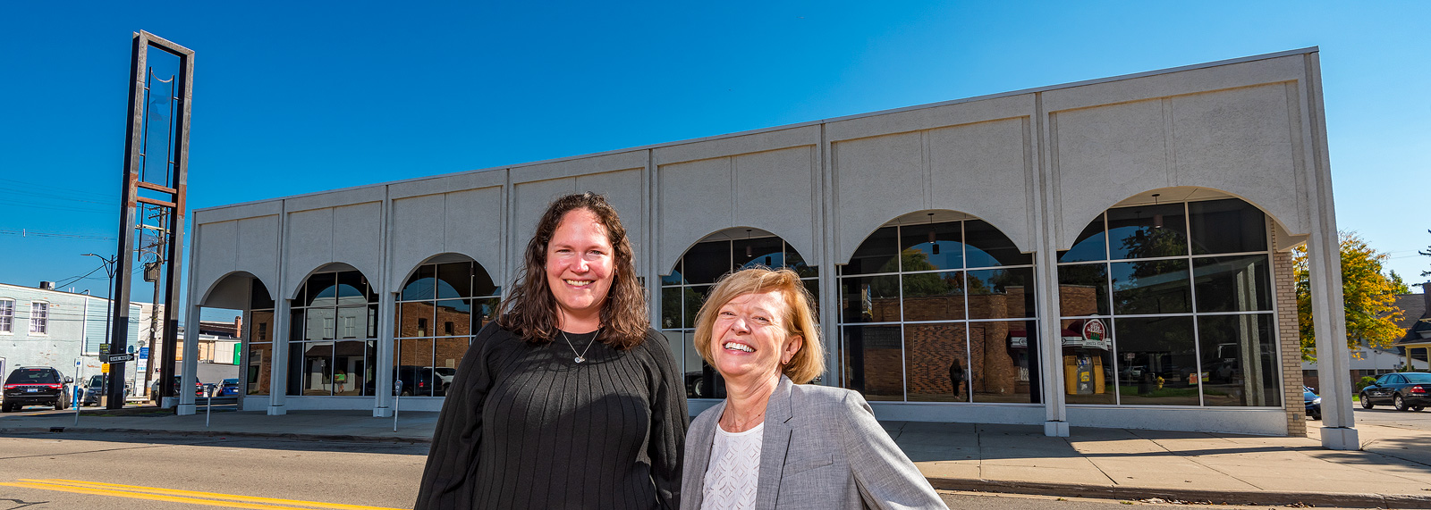 Alyson Robbins and Ann Routt of MAP in front of the Smith Furniture buidling