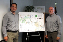 Peter Sanderson and Coy Vaughn with a map of the B2B Trail.