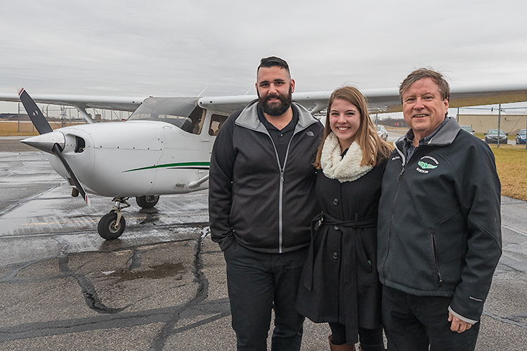 Tom Simon, Anna Buchel and Jerard Delaney at the Eagle Flight Centre at Willow Run Airport