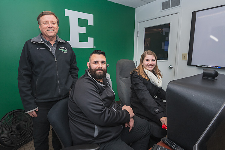 Jerard Delaney, Tom Simon and Anna Buchel at the Eagle Flight Centre at Willow Run Airport