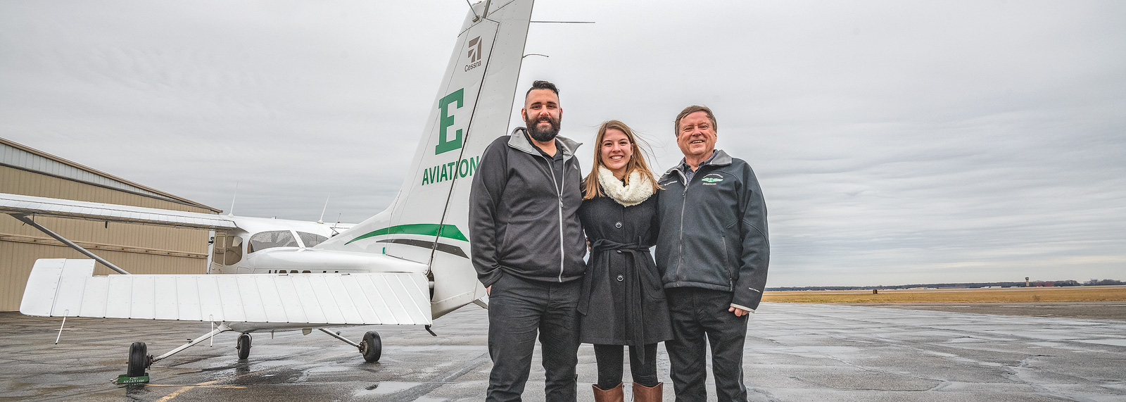 Tom Simon, Anna Buchel and Jerard Delaney at the Eagle Flight Centre at Willow Run Airport